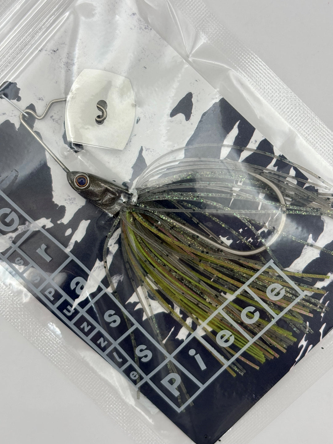 Bass Puzzle GrassPiece - Baby Blue Bomber / 3/8 oz / Original-Baby Blue Bomber / 3/8 oz / MiniBlade-Baby Blue Bomber / 1/2 oz / Original-Baby Blue Bomber / 1/2 oz / MiniBlade-Baby Blue Bomber / 3/4 oz / Original-Baby Blue Bomber / 3/4 oz / MiniBlade-Black &amp; Blue / 3/8 oz / Original-Black &amp; Blue / 3/8 oz / MiniBlade-Black &amp; Blue / 1/2 oz / Original-Black &amp; Blue / 1/2 oz / MiniBlade - Carolina Fishing Tackle LLC